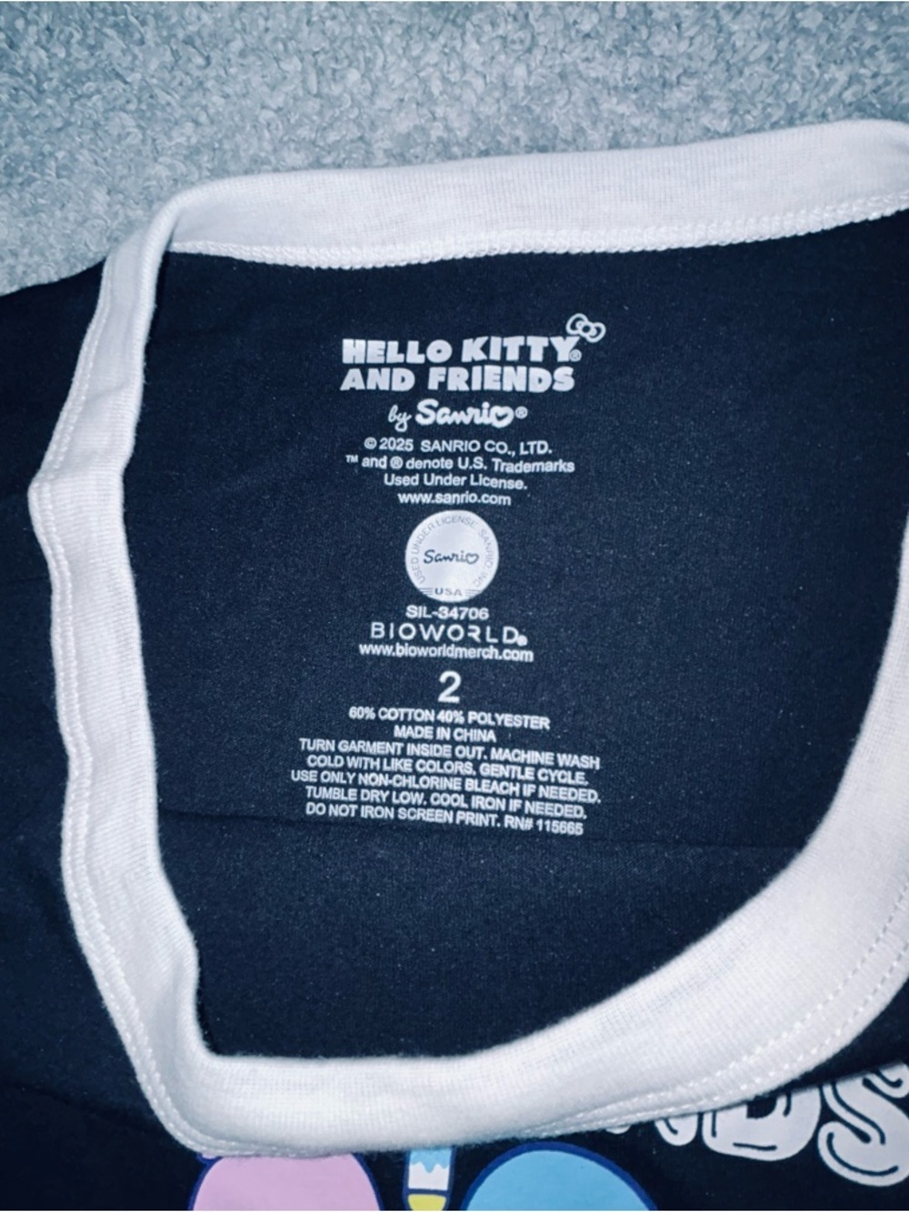 torrid size 2x Black Tee with White Trim and Pastel Hello Kitty Rainbow Graphic - Picture 3 of 4
